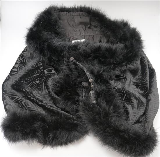 A 1930s black velvet feather trimmed jacket/cape